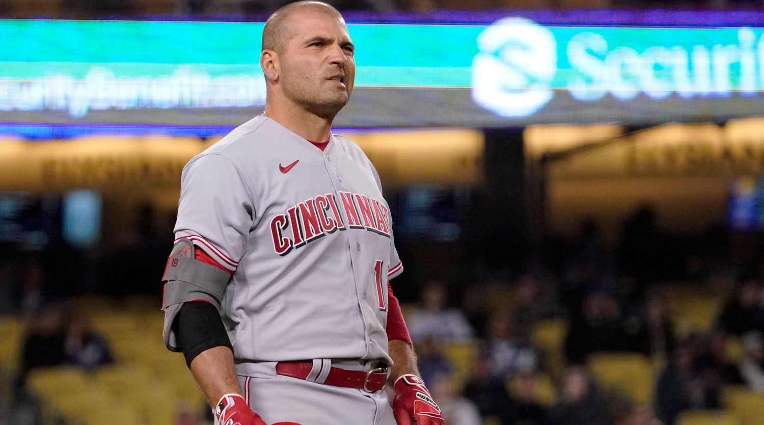 Cincinnati Reds’ Joey Votto reacts as a long ball that he hit just barely went foul during the ninth inning of a baseball game against the Los Angeles Dodgers Saturday, April 16, 2022, in Los Angeles.